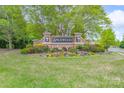 Community entrance sign for Spicewood, surrounded by colorful flowers and lush greenery at 1144 Spicewood Pines Rd, Fort Mill, SC 29708