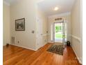Bright foyer with hardwood floors and neutral paint at 11778 Crossroads Pl, Concord, NC 28025