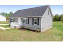 Well maintained single-story home featuring black shutters and manicured landscaping at 123 Pumice Dr, Statesville, NC 28625