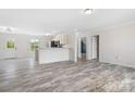Open-concept living space with natural light and attractive flooring at 123 Pumice Dr, Statesville, NC 28625