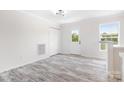 View of the bright living room with wood-look floors and a back door at 123 Pumice Dr, Statesville, NC 28625