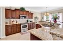 Well-appointed kitchen with granite countertops, stainless steel appliances, and ample cabinet space at 141 Ivy Creek Ln, Mooresville, NC 28115