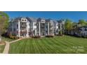 Multi-story condo features a large lawn with mature landscaping and private balconies in a desirable community setting at 18700 Nautical Dr # 101, Cornelius, NC 28031