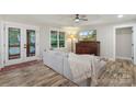 Bright living room with natural light, a comfortable couch, and wood-look floors at 207 Blythe Mill Rd, Waxhaw, NC 28173