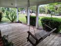 Inviting covered front porch with a relaxing swing, perfect for enjoying the outdoors at 2508 S Main St # 68, Concord, NC 28027
