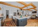 A kitchen showcasing a central island, stainless appliances, and an open layout for seamless entertaining and dining at 3228 E Ford Rd, Charlotte, NC 28205