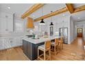 This kitchen features a large island, quartz countertops, stainless steel appliances and lots of cabinet space at 3228 E Ford Rd, Charlotte, NC 28205