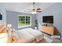 Main bedroom featuring a vaulted ceiling, large windows, and modern flooring at 526 Pennyfields Ln, Clover, SC 29710