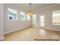 Bright living room featuring large windows, a glass patio door, and hardwood floors at 1107 Meander Ln, Waxhaw, NC 28173