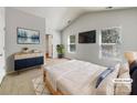 Bright bedroom with vaulted ceilings, large windows, and stylish decor at 1107 Stonehenge Ln, Charlotte, NC 28216