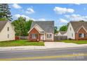Street view of a cozy home with a brick and siding exterior, neat landscaping, and a driveway at 126 Newsome Rd, Salisbury, NC 28146