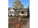 Lovely single-story home with a covered porch and charming architectural details at 240 North Ave, Troutman, NC 28166