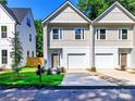 A modern new construction duplex with a well-manicured lawn and a convenient driveway at 2505 Elon St, Charlotte, NC 28208