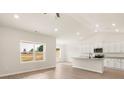 Bright open-concept living space with modern kitchen and large windows at 3346 Strong Box Ln, Gastonia, NC 28052