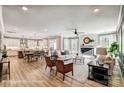 Bright, open-concept living area featuring a fireplace, abundant natural light, and seamless flow to the modern kitchen at 5380 Pembrey Dr # Lot 26, Denver, NC 28037
