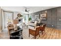 Stylish living room boasts a fireplace, decorative wall paneling, and ample seating for comfortable gatherings at 5380 Pembrey Dr # Lot 26, Denver, NC 28037