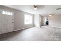 Bright, open living room with a large window, new floors and fresh paint at 606 W 19Th Ave, Gastonia, NC 28052