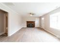 Inviting living room with a decorative fireplace, large window, and plenty of space at 606 W 19Th Ave, Gastonia, NC 28052