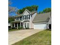 Beautiful two-story home featuring a spacious driveway and attached garage at 9003 Brad Ct, Matthews, NC 28104