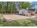 Large concrete driveway and extra parking pads near the side entrance at 101 Grier St, York, SC 29745