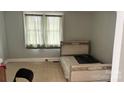 Bright bedroom featuring a large window providing ample natural light at 116 Morning Glory Ave, Belmont, NC 28012