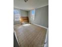 Neutral bedroom with tiled floors and a window view at 116 Morning Glory Ave, Belmont, NC 28012