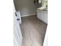 The laundry room area features new flooring and storage at 116 Morning Glory Ave, Belmont, NC 28012