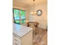 Cozy dining area featuring a chandelier and large windows at 11824 Larkridge Ct, Charlotte, NC 28226