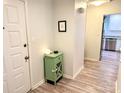 Hallway with a view of the kitchen and sleek, modern flooring at 11824 Larkridge Ct, Charlotte, NC 28226