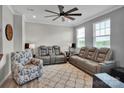 Comfortable living room with gray reclining sofas, a ceiling fan, and stylish decor at 138 Marron Dr # 25, Indian Trail, NC 28079