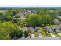 Expansive aerial view of a residential neighborhood with mature trees and well-maintained homes and landscapes at 1682 Sandpiper Dr, Rock Hill, SC 29732