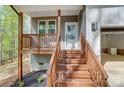 The front porch of the home features wooden stairs and railings at 176 Forest Creek Dr, Statesville, NC 28625