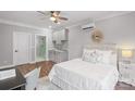 Inviting bedroom with light gray walls, a kitchenette, and a comfortable bed at 2200 Stratford Ave, Charlotte, NC 28205