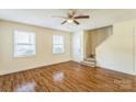 Inviting living room with hardwood floors, staircase, and natural light at 266 Kelly St, Statesville, NC 28677