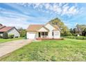 Charming one-story home features a front porch, green lawn, and attached one-car garage at 2703 Plantation Way, Albemarle, NC 28001