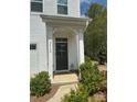 Close-up of the front door with sidelights, landscaping, and house number at 2932 Pirates Pl, Charlotte, NC 28216