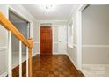 Elegant foyer with hardwood floors and staircase leading to the upper level at 3005 Kenninghall Ct, Charlotte, NC 28269