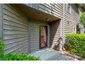 Charming townhome entrance featuring a secure, glass-paned front door at 3625 Colony Crossing Dr, Charlotte, NC 28226