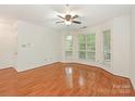 Bright living room featuring a ceiling fan, natural light and hardwood flooring at 415 Mather Green Ave # I, Charlotte, NC 28203