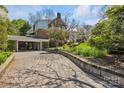 Long brick driveway leads to a brick home with an attached carport at 528 1St Nw Ave, Hickory, NC 28601