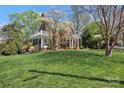 Beautiful brick home on an elevated lot with mature trees and a screened porch at 528 1St Nw Ave, Hickory, NC 28601
