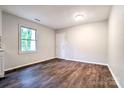 Spacious living area featuring wood-look floors, fresh paint, and lots of natural light at 805 32Nd Street Ne Dr, Conover, NC 28613