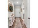 Inviting entryway with hardwood floors, console table, and stylish decor at 9077 Myrna Dr, Gastonia, NC 28056
