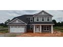 Charming two-story home with a two-car garage and covered front porch at 1015 Gardenia Dr # 52, Mt Ulla, NC 28125
