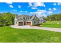 Charming home featuring a well-maintained lawn and inviting driveway at 108 Castleview Ln, Mooresville, NC 28115