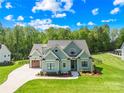 Attractive home with a manicured lawn and convenient two-car garage at 108 Castleview Ln, Mooresville, NC 28115