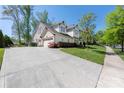 Spacious home featuring a large driveway and beautiful landscaping at 12942 Blakemore Ave, Huntersville, NC 28078