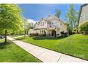 Well-maintained home with lush green lawn and a welcoming entrance at 12942 Blakemore Ave, Huntersville, NC 28078