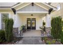 Inviting front porch with double doors and stylish decor at 12942 Blakemore Ave, Huntersville, NC 28078