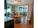 Open dining area with hardwood floors, view of living room, and lots of light at 1306 Brantley Rd, Kannapolis, NC 28083